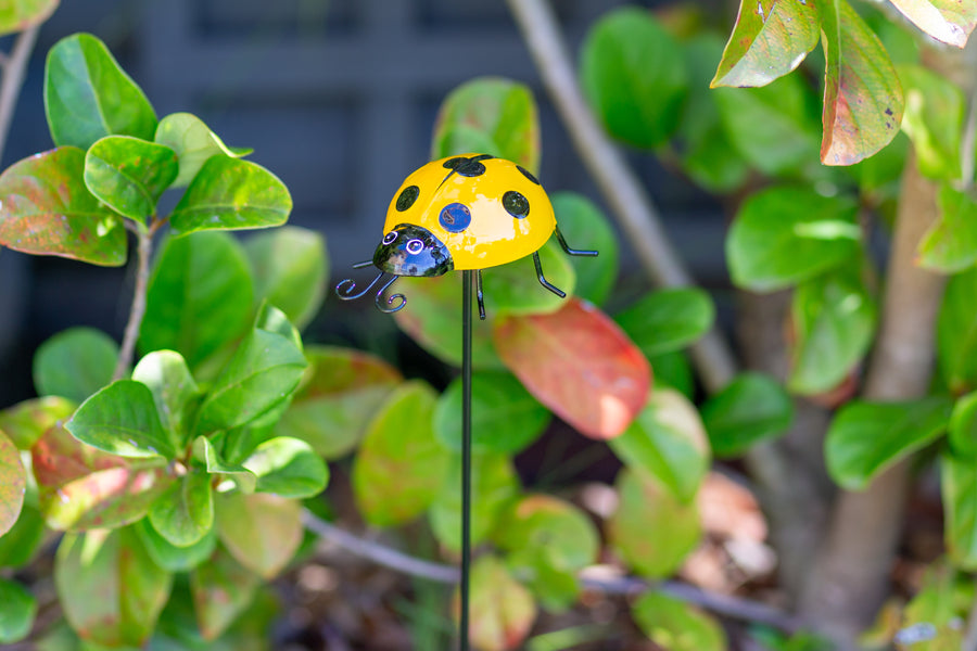 yellow metal ladybug garden stake