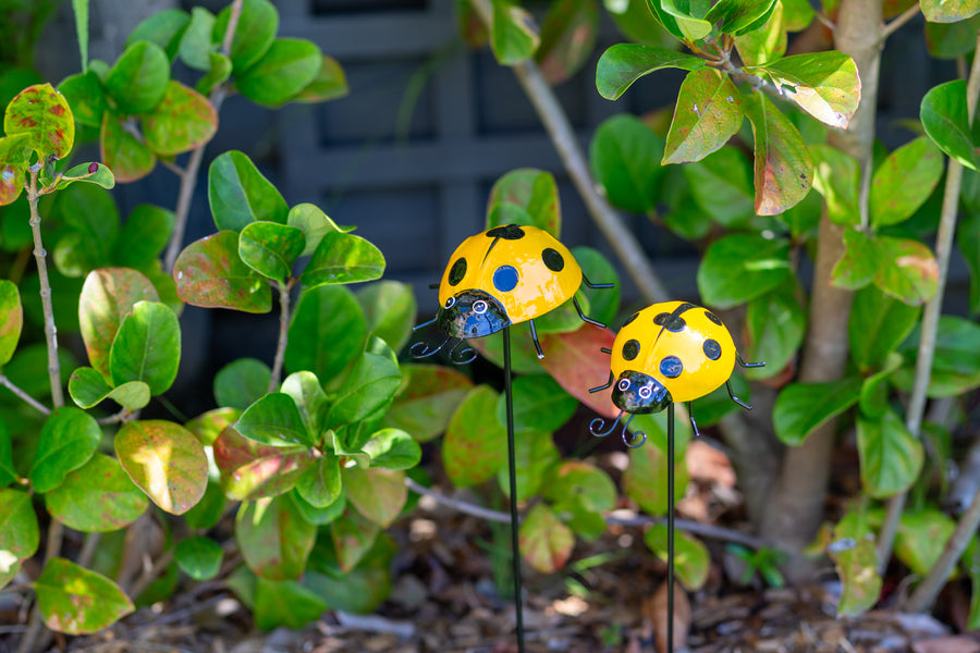 yellow metal ladybug garden stakes